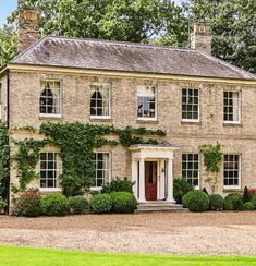 an old brick house with ivy growing on it