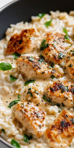 chicken and rice dish in a pan with garnishes on the side, ready to be eaten