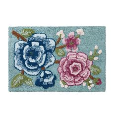 a blue door mat with two flowers on the front and one flower on the back