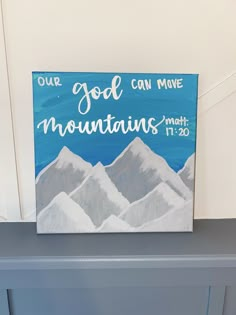 a painting that says, our god can move mountains