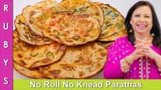 a woman standing in front of a pile of flatbreads with the caption, no roll knead parathas