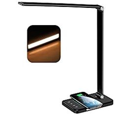 an image of a desk lamp with a cell phone on it and the light turned on