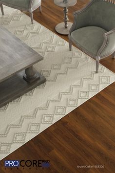 a living room filled with furniture on top of a hard wood floor covered in white rugs