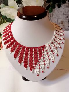 A beautiful red and white Victorian style necklace made of Czech beads Length 17 inches (44 cm), lengthening chain 2 inches(5 cm) Vintage White Choker Necklace, Red Beaded Bib Necklace, Vintage White Necklace With Colorful Beads, Handmade White Choker Necklace, Elegant White Choker With Colorful Beads, Handmade Vintage White Necklace, Handmade Red Bib Necklace With Round Beads, Traditional White Choker With Round Beads, Vintage White Handmade Choker