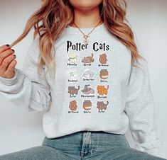 Gildan 1800 , Potter Cats Sweatshirt high quality UV Ink prints!  We advise machine washing with cold water and hanging to dry for longevity. Size up for an oversized look!  WHY SHOP MOODY?! 🌸 All of our designs are uniquely curated, designed, and made in our warehouse.  📦 Each of our orders are inspected for 100% accuracy, are packed securely, and shipped within 1-3 business days.  💕 We're here for you! We offer support 7 days a week!  🇺🇸Designed and manufactured in the USA! Ask me about b Harry Potter Sweaters, Embroidered Harry Potter Sweatshirt, Cute Harry Potter Sweatshirt, Harry Potter Sweatshirt Kids, Fandom Graphic Print Crew Neck Sweatshirt, Pottery Gifts, Cat Sweatshirt, Fall Sweater, Cat Lover Gift