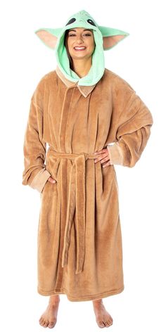 a man in a star wars robe is wearing an adult yoda bathrobe