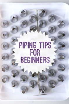 a white tray filled with lots of metal balls and pins on top of the words piping tips for beginners