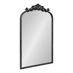 a large mirror with an ornate frame on the top and bottom part, in black