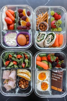 four plastic containers filled with different types of food and fruit on top of each other