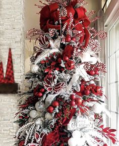 a christmas tree decorated with red and white ornaments