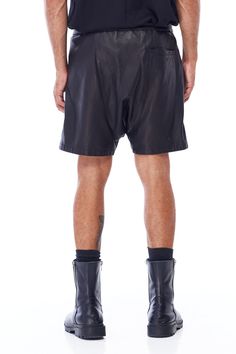 A unisex staple, JONNY COTA's new Drop Crotch Leather Shorts are handcrafted from luxe leather cut in a modern drop crotch silhouette. Wide elasticized waistband with cotton drawstring Backslash pocket 100% sheepskin leather 100% lining polyester Care instructions: Specialty cleanSIZE + FIT Loose, drop crotch fit Fits true to size Leather Cuts, Leather Shorts, Jewelry Sales, Jumpsuit Dress, Leather, Black