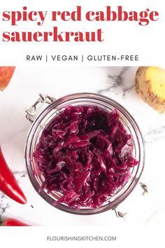 red cabbage in a glass bowl next to sliced vegetables