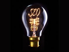 an illuminated light bulb with the word motivation written on it in gold and white lettering