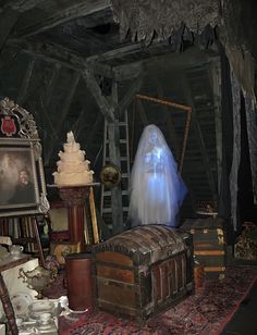 there is a ghost in the room next to some old suitcases and other items