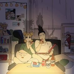 two people sitting on a couch eating pizza and drinking beer in the living room at night