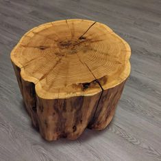 a piece of wood that has been cut in half and is sitting on the floor