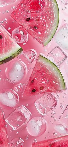 slices of watermelon and ice cubes on pink liquid