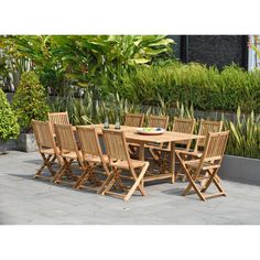 a wooden table and chairs on a patio