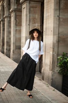 Wide-leg linen pants with a half skirt detail in front with an elasticated waistline for comfort and a better fit. Full-length pants are wide, very wide, and flattering on the bottom. From the front view, it looks like a long skirt, but from the back - as wide pants. Washed linen pants turn into a standout outfit for countless occasions. In addition, it's a perfect fit for any daily activities, even to look dressy. Wear with sandals for a relaxed sense of style. With high heels to attract the cr Relaxed Wide Hem Maxi Skirt For Summer, Summer Maxi Skirt With Wide Hem And Relaxed Fit, Summer Maxi Skirt With Wide Hem, Summer Relaxed Fit Linen Maxi Skirt, Summer Linen Relaxed Fit Maxi Skirt, Relaxed Linen Maxi Skirt For Summer, Vacation Wide-leg Linen Maxi Skirt, Summer Linen Maxi Skirt With Elastic Waistband, Black Linen Wide Leg Pants For Summer