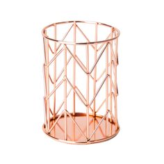 a pink metal vase with geometric designs on it