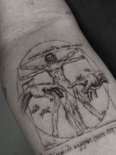 a man's arm with a drawing on it that says jesus and the crucifix