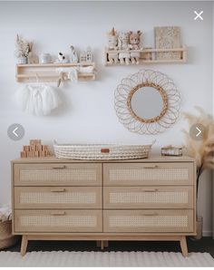 a baby's room with white walls and wooden furniture