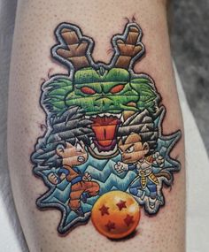 an image of a cartoon character tattoo on someone's leg with the ball in front of him