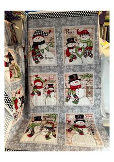 a quilted blanket with snowmen on it