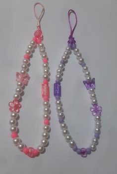 two bracelets with pink and purple beads on white background, one beaded to the other