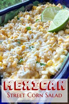 mexican street corn salad in a blue casserole dish with lime wedge on top