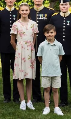 the family is posing for a photo in uniform