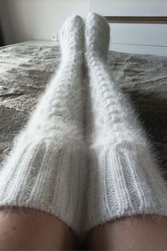 High socks are knitted from angora with the addition of nylon (for durability). Angora yarn is made from angora rabbit down, so the socks are very soft and delicate. These long socks are warm, cozy and fluffy. Look how These socks can be called stockings) You can wear them when doing household chores or when watching TV on the couch. You will look very impressive! Dress them in bed and you will be warm, soft and cozy. I knit with premium quality yarn. Composition: 80% angora (rabbit), 20% polyam White Warm Knee-high Socks, Warm White Knee-high Socks, Comfortable Warm White Knee-high Socks, Soft White Knee-high Socks For Winter, Comfortable White Knee-high Leg Warmers, White Knee-high Comfortable Leg Warmers, Cozy Thick White Socks, Cozy White Leg Warmers For Stocking Stuffers, Thick Warm White Socks