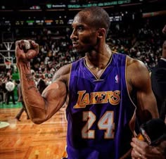 an image of a professional basketball player on the court with his fist up in celebration