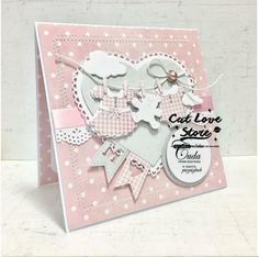 a card made with pink and white paper