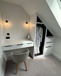 a white desk and chair in a room with an attic style ceiling fan above it