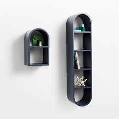 two blue shelves with books on them next to each other in the shape of an arch