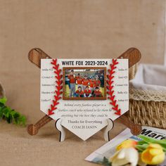 a baseball themed photo frame on a table