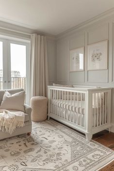 a baby's room with a crib, chair and rug