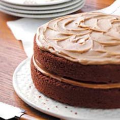 a chocolate cake sitting on top of a white plate