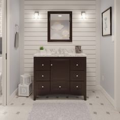 a bathroom with a sink, mirror and toilet