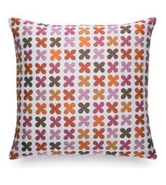 an orange and pink pillow on a white background with brown, red, and yellow flowers