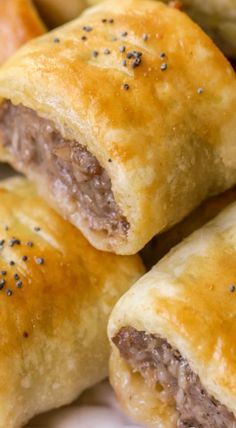 some sausage rolls are sitting on a plate