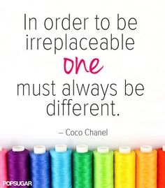 there are many spools of thread in front of a white sign that says, i'm order to be irreplaceable one must always be different