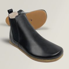 A wildly comfortable all-season boot, handcrafted by artisans using soft tumbled Nubuck leather. Bold, deep goring panels heighten the impact of this handsome Chelsea-styled minimal boot, for maximum versatility while providing a true “fits like a glove” feel. They feature a wide toe-box and zero-drop design to ensure a perfect, natural fit and a healthy gait. These classic grounding boots are handmade with natural materials that only get better with time and wear. Stay grounded. Wide Toe Box Boots, Barefoot Chelsea Boots, Grounding Shoes, Short Leather Boots, Stay Grounded, Chelsea Boots Women, Leather Dye, Drop Design, Comfortable Boots