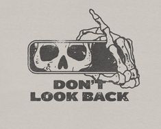 a t - shirt that says don't look back with a skull in it