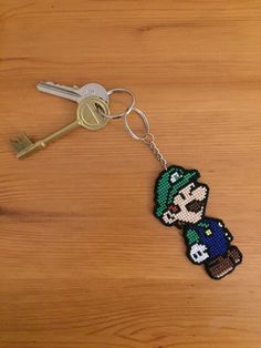 a keychain with an image of mario on it