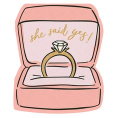 a pink box with a gold ring inside that says she said i'm getting married