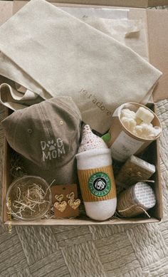 the contents of a starbucks coffee box are neatly packed and ready to be delivered into someone's home