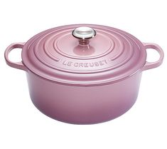 a pink casserole is shown on a white background with the word le creuset above it