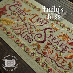 a cross stitch pattern with the words, family's bliss written in red and yellow